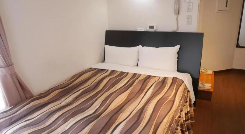 Bed in Hotel Tetora Tsurumi