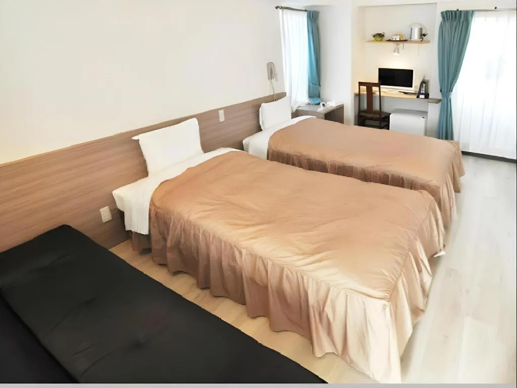 Bed in Hotel Tetora Tsurumi