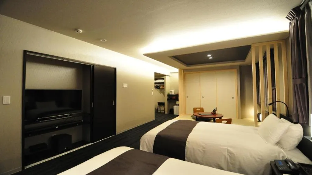 Bed in Hotel Obokekyo Mannaka