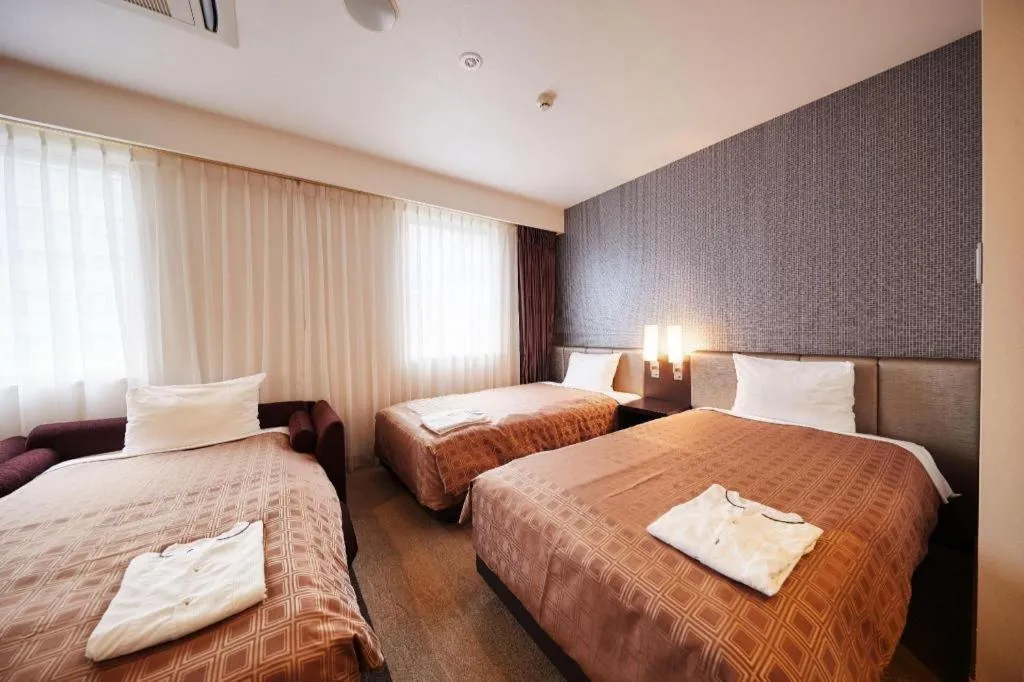 Bed in Hotel Yuquesta Asahibashi