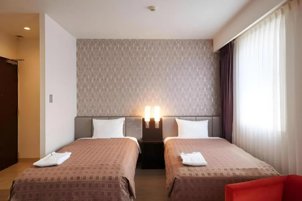 Bed in Hotel Yuquesta Asahibashi