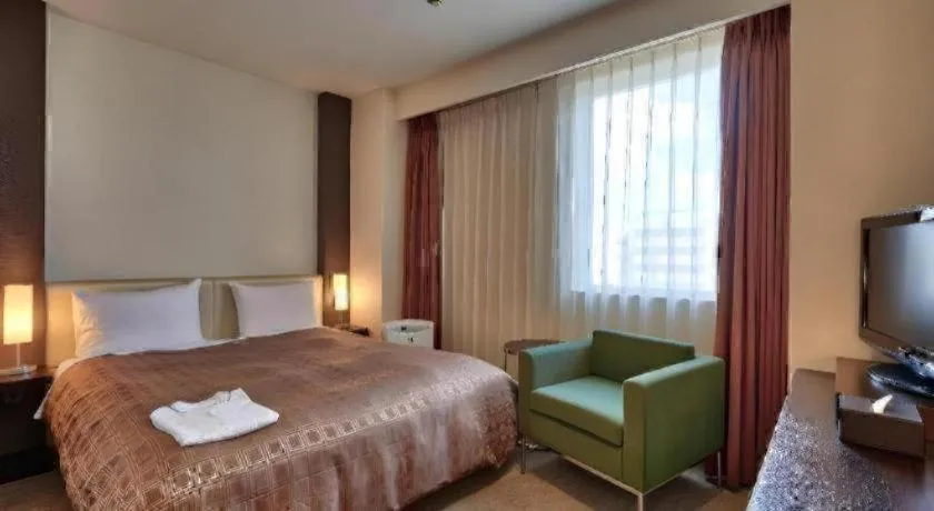 Bed in Hotel Yuquesta Asahibashi