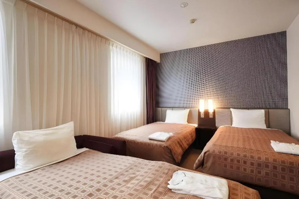 Bed in Hotel Yuquesta Asahibashi