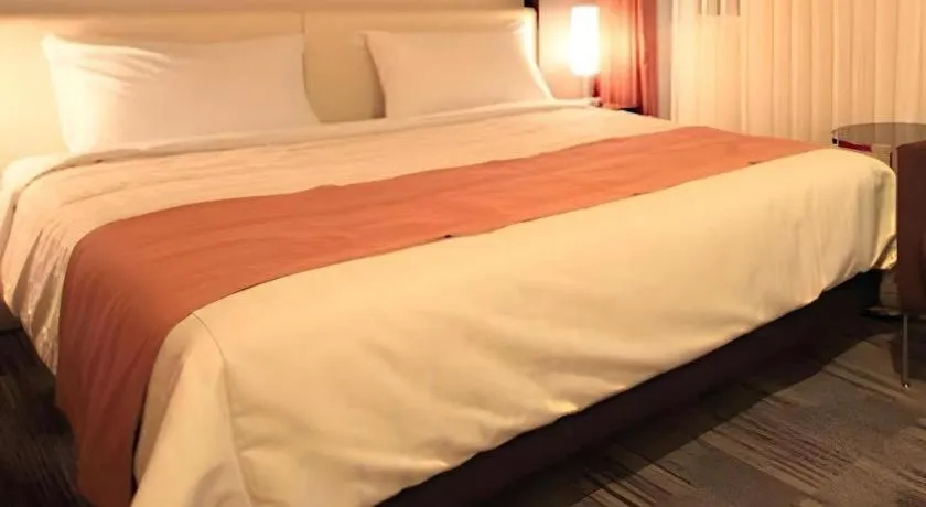 Bed in Hotel Yuquesta Asahibashi