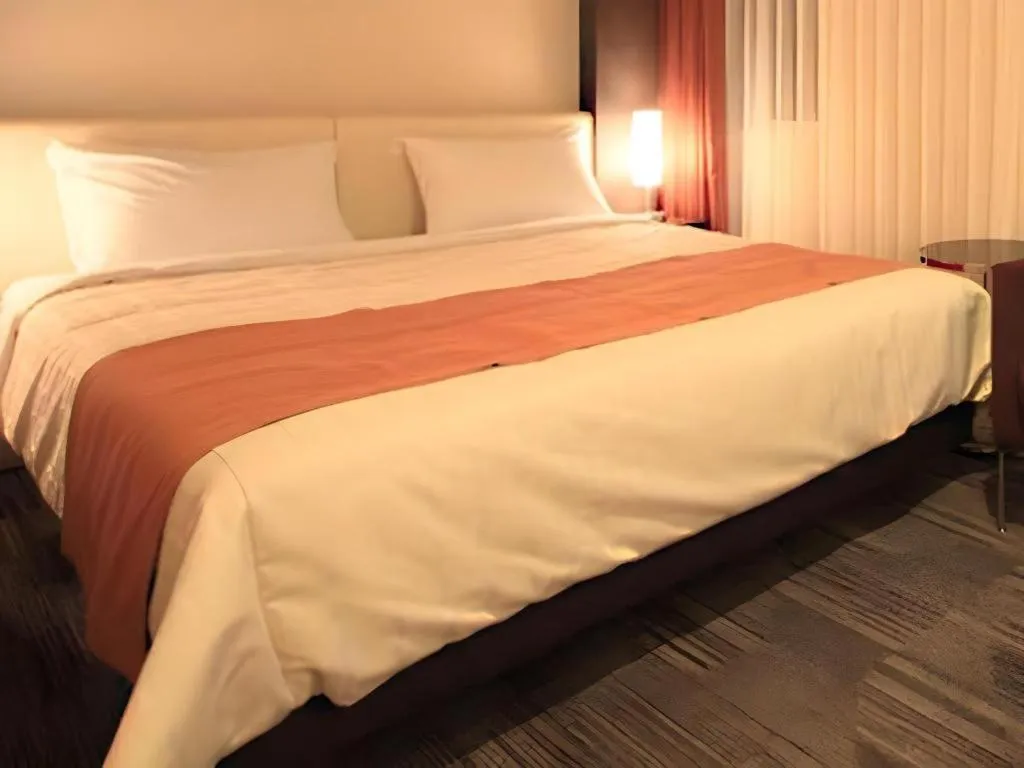 Bed in Hotel Yuquesta Asahibashi