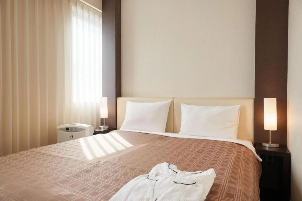 Bed in Hotel Yuquesta Asahibashi