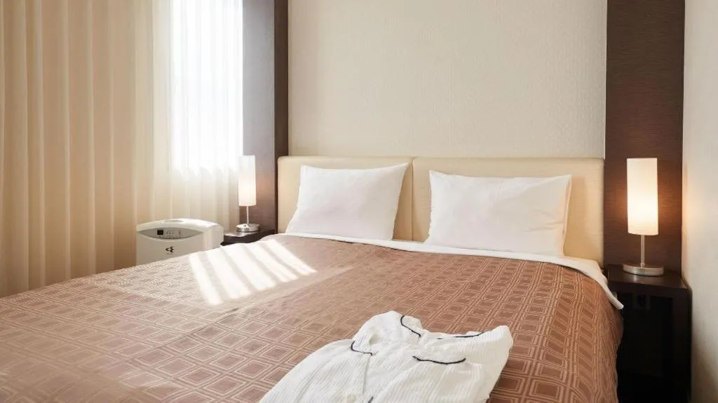 Bed in Hotel Yuquesta Asahibashi