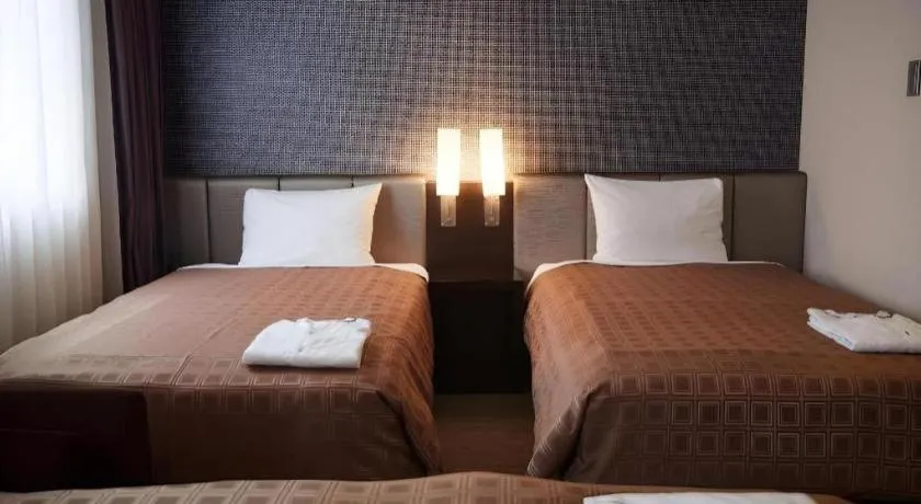 Bed in Hotel Yuquesta Asahibashi