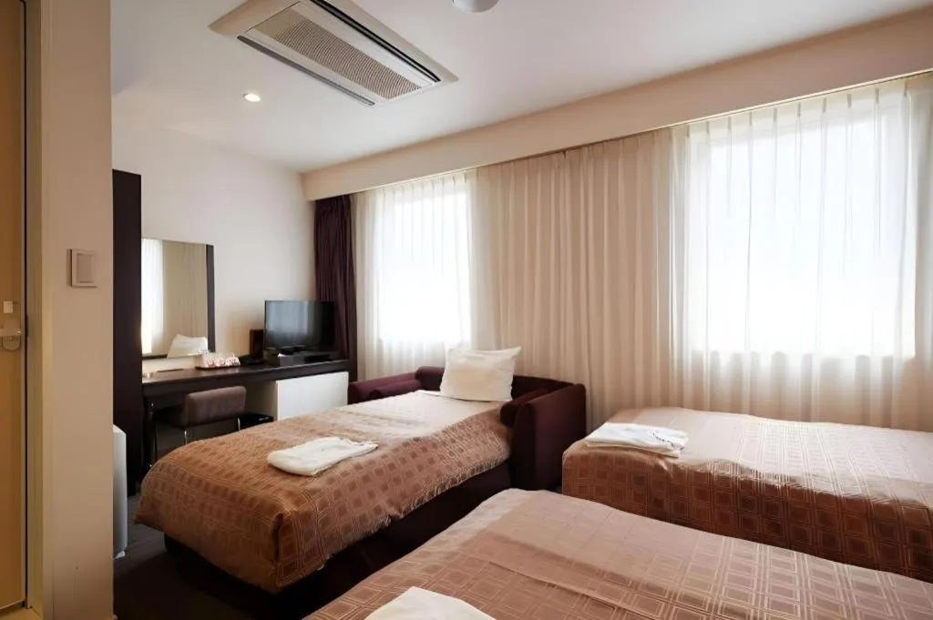 Bed in Hotel Yuquesta Asahibashi