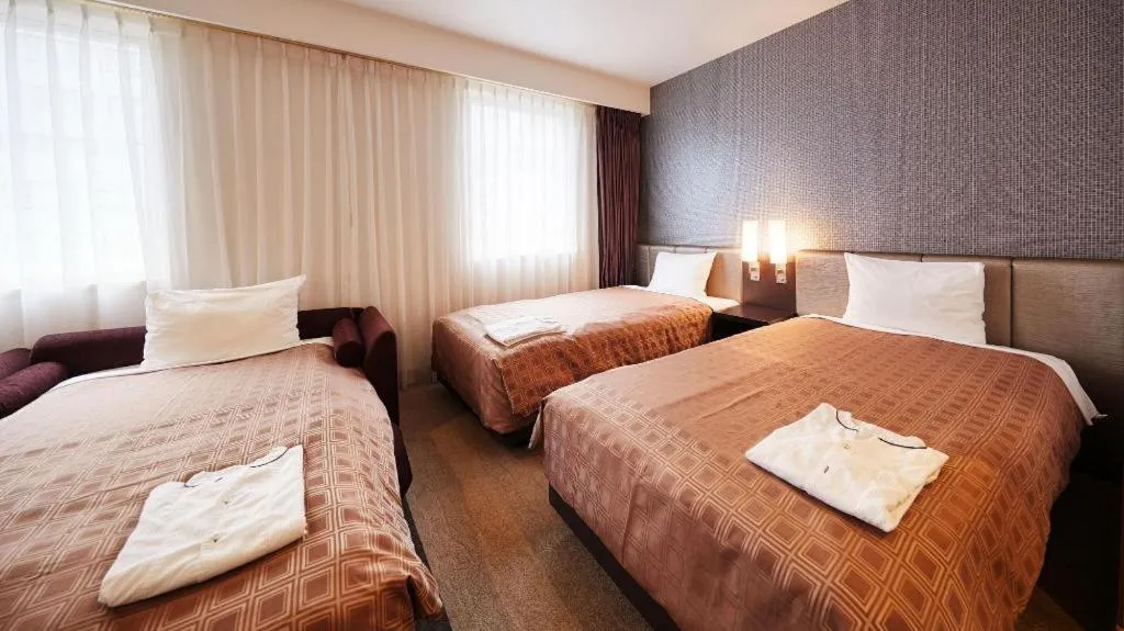 Bed in Hotel Yuquesta Asahibashi