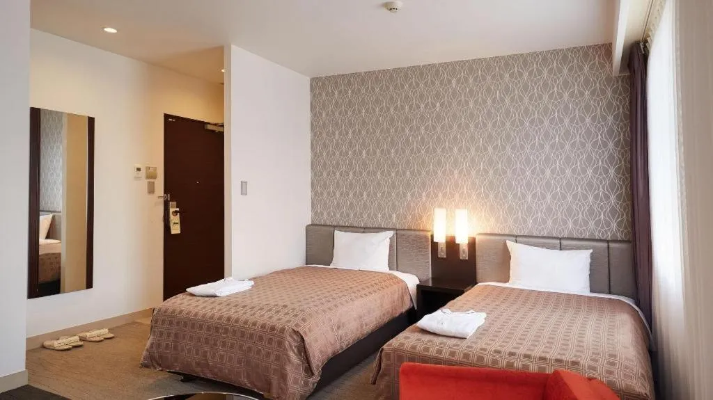 Bed in Hotel Yuquesta Asahibashi