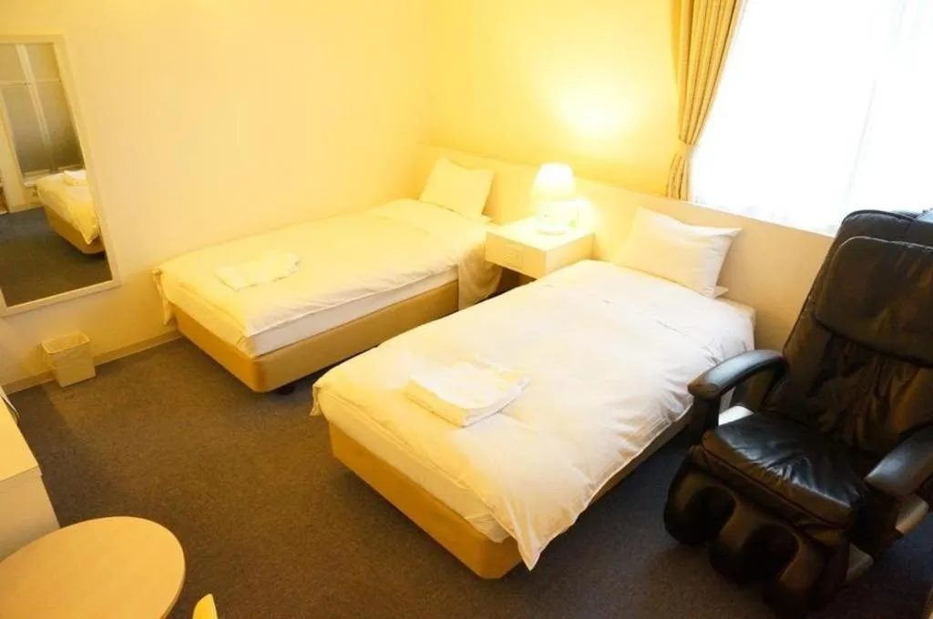 Bed in Hotel The Grand Court Matsusaka