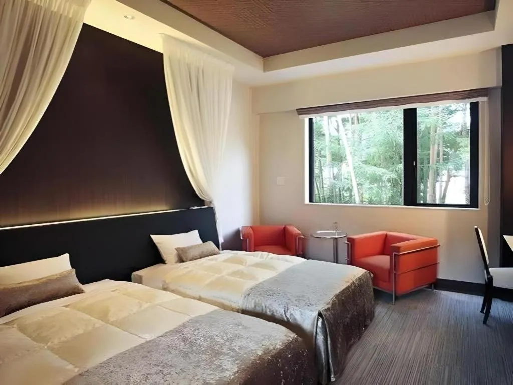 Bed in Sakuraan Kawaguchiko Hotel