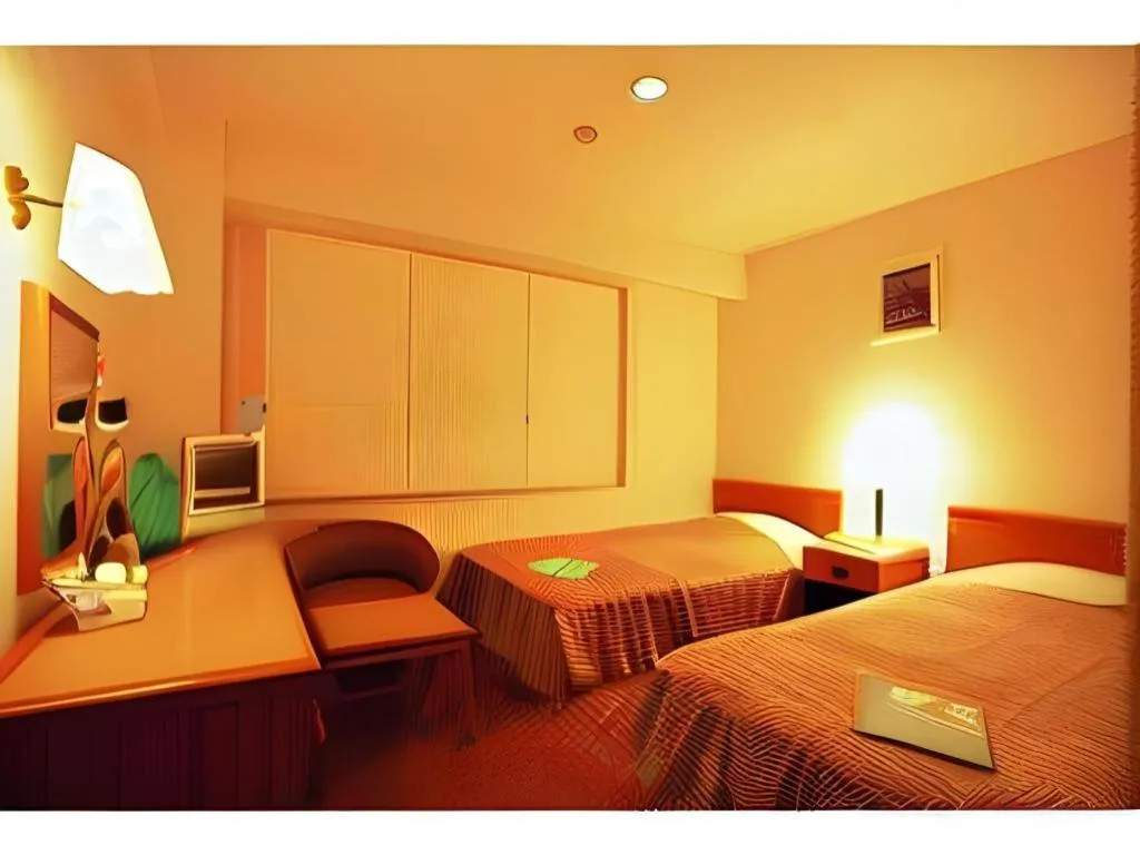 Bed in Mizue Dai-ichi Hotel