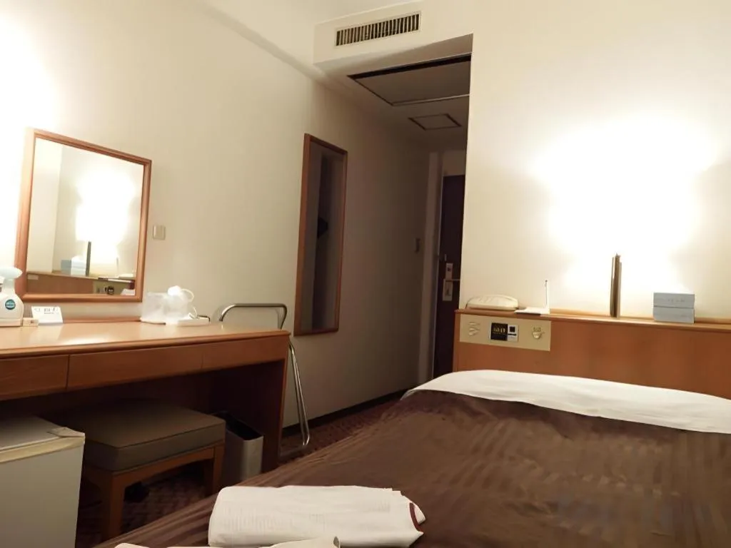 Bed in Mizue Dai-ichi Hotel