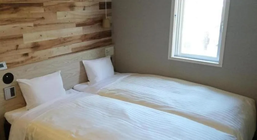 Bed in Super Hotel Hakodate