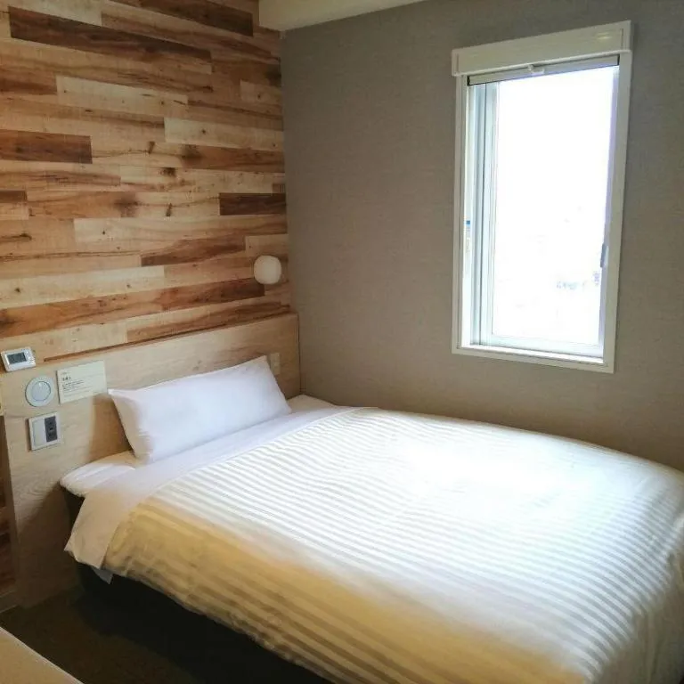 Bed in Super Hotel Hakodate