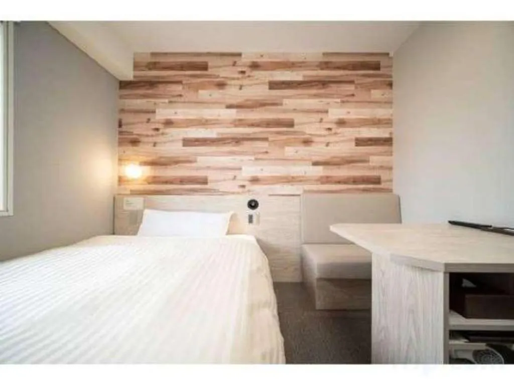 Bed in Super Hotel Hakodate
