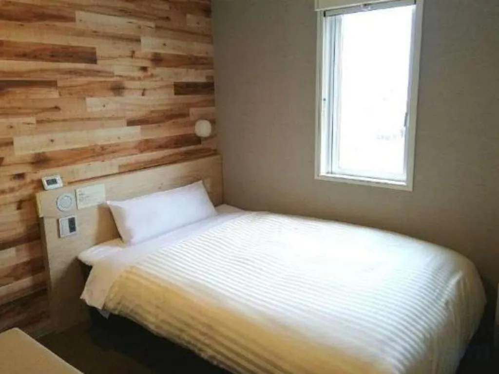 Bed in Super Hotel Hakodate