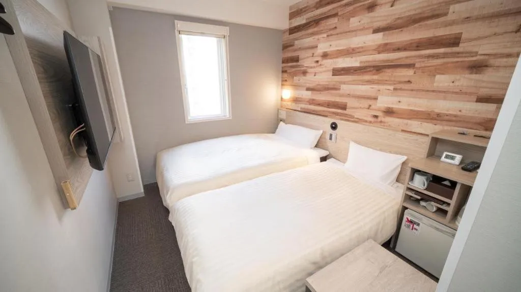 Bed in Super Hotel Hakodate