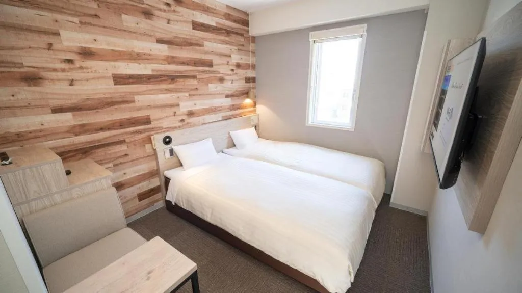 Bed in Super Hotel Hakodate