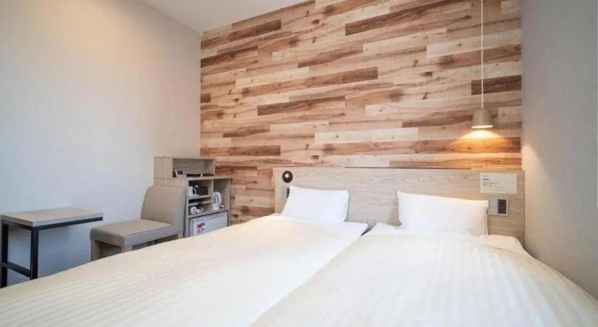 Bed in Super Hotel Hakodate