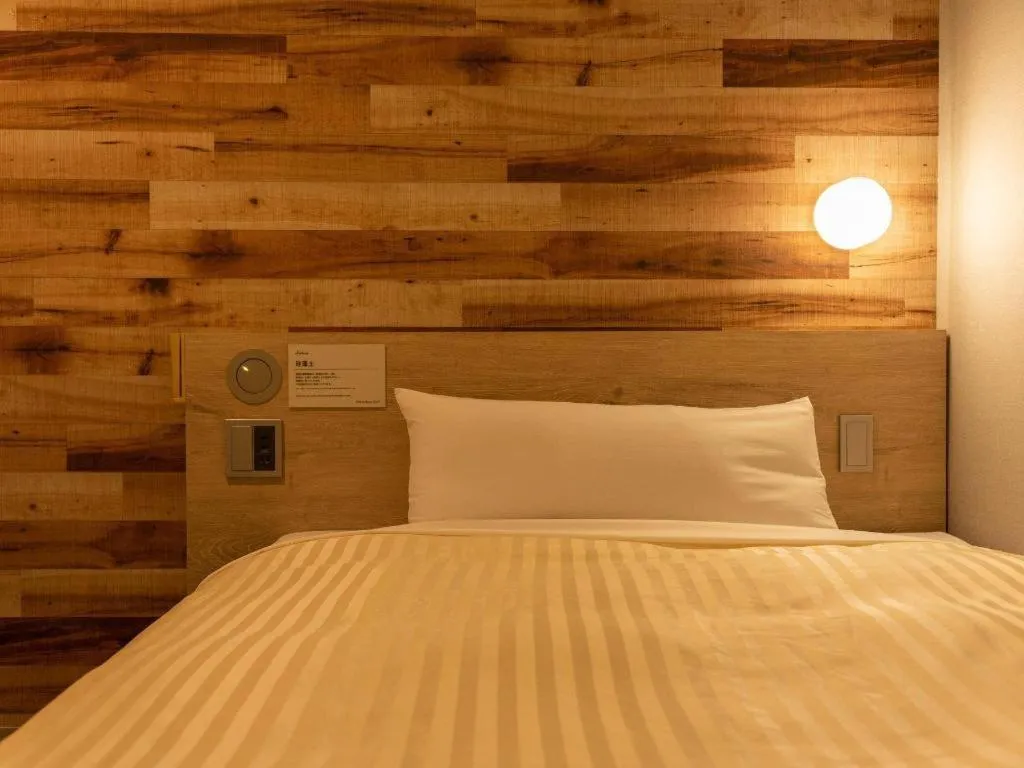 Bed in Super Hotel Hakodate