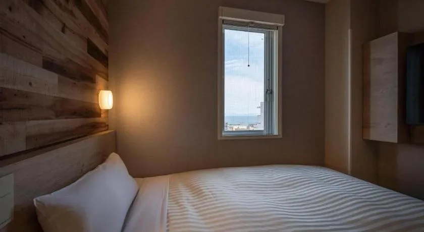 Bed in Super Hotel Hakodate