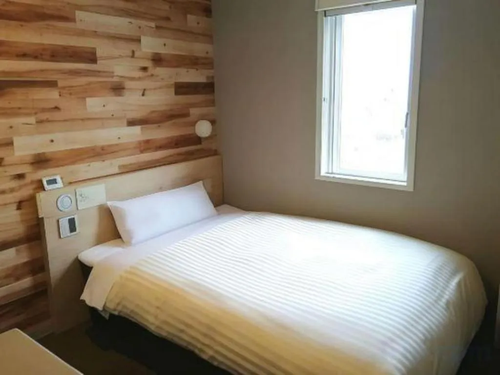 Bed in Super Hotel Hakodate