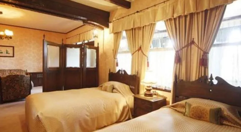 Bed in Unzen Kanko Hotel