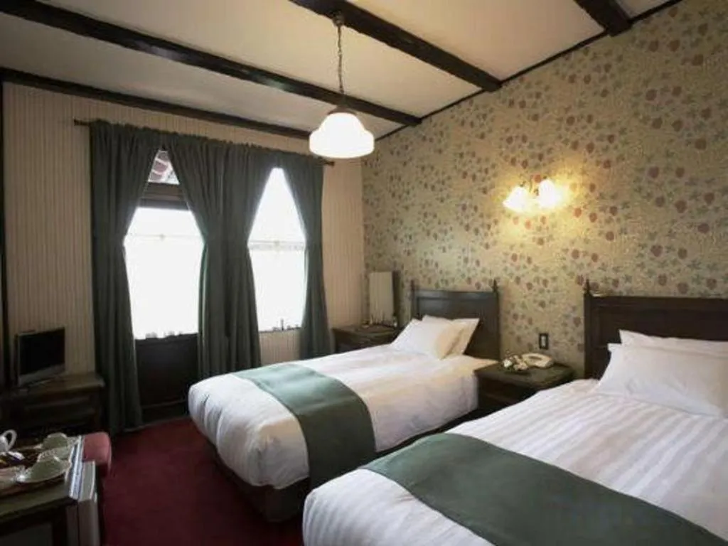 Bed in Unzen Kanko Hotel