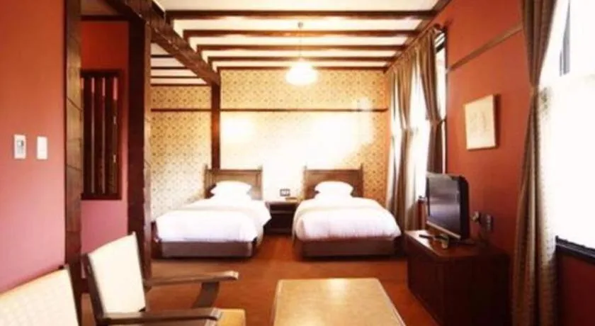 Bed in Unzen Kanko Hotel