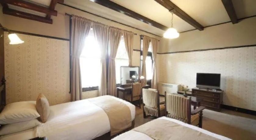 Bed in Unzen Kanko Hotel