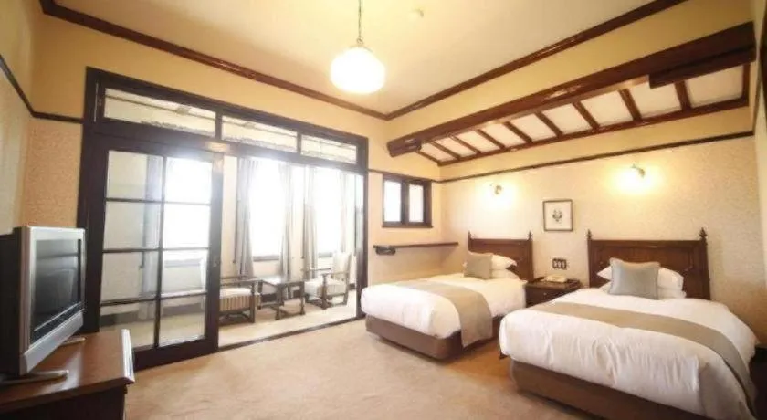 Bed in Unzen Kanko Hotel