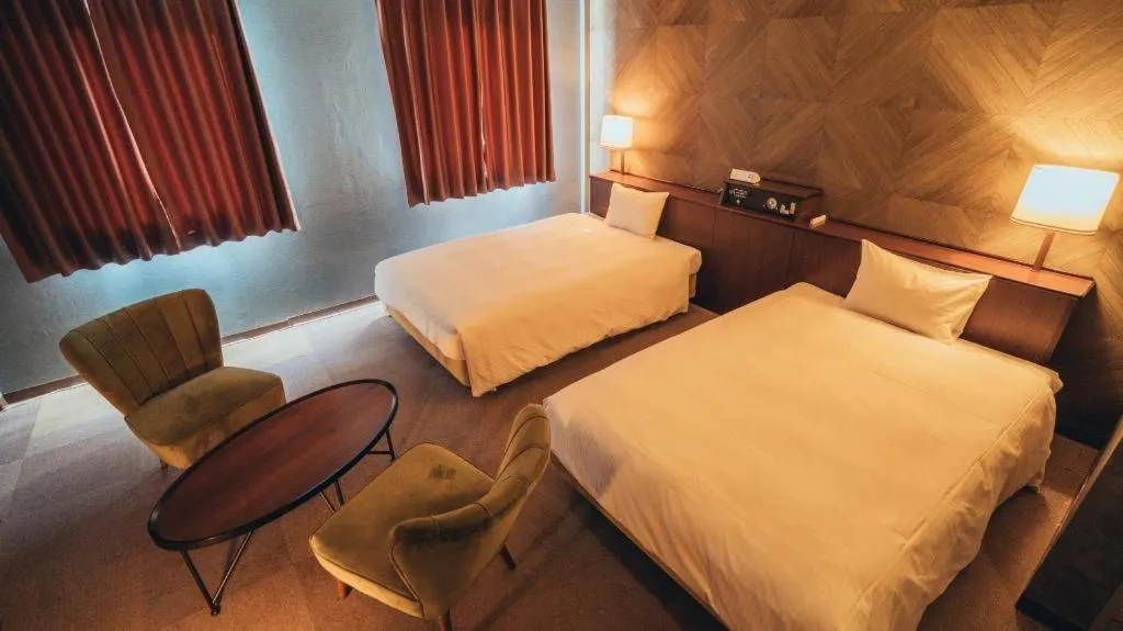 Bed in Hotel AreaOne Miyazaki City