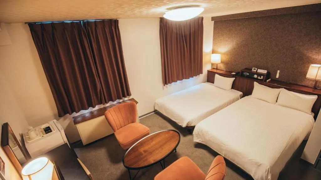 Bed in Hotel AreaOne Miyazaki City