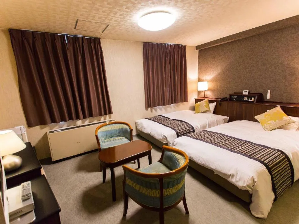 Bed in Hotel AreaOne Miyazaki City