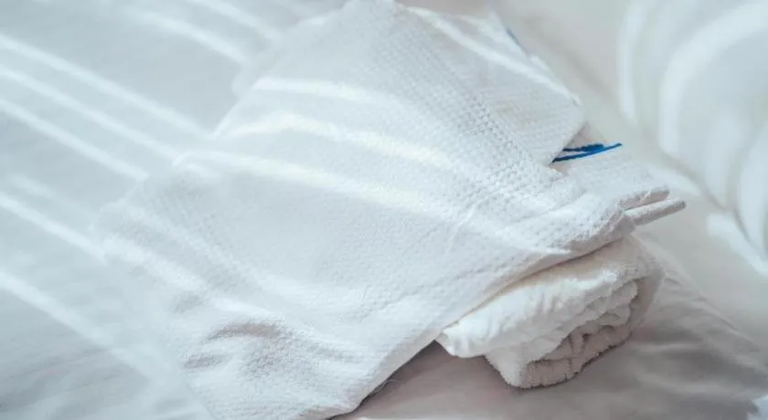 Bed in Hotel AreaOne Miyazaki City