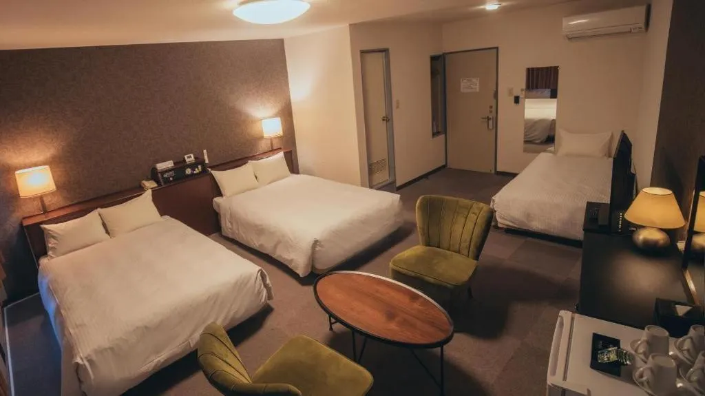 Bed in Hotel AreaOne Miyazaki City