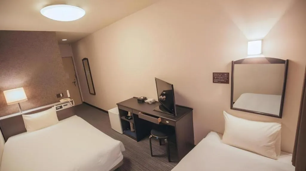 Bed in Hotel AreaOne Miyazaki City