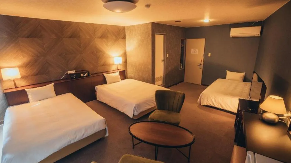 Bed in Hotel AreaOne Miyazaki City