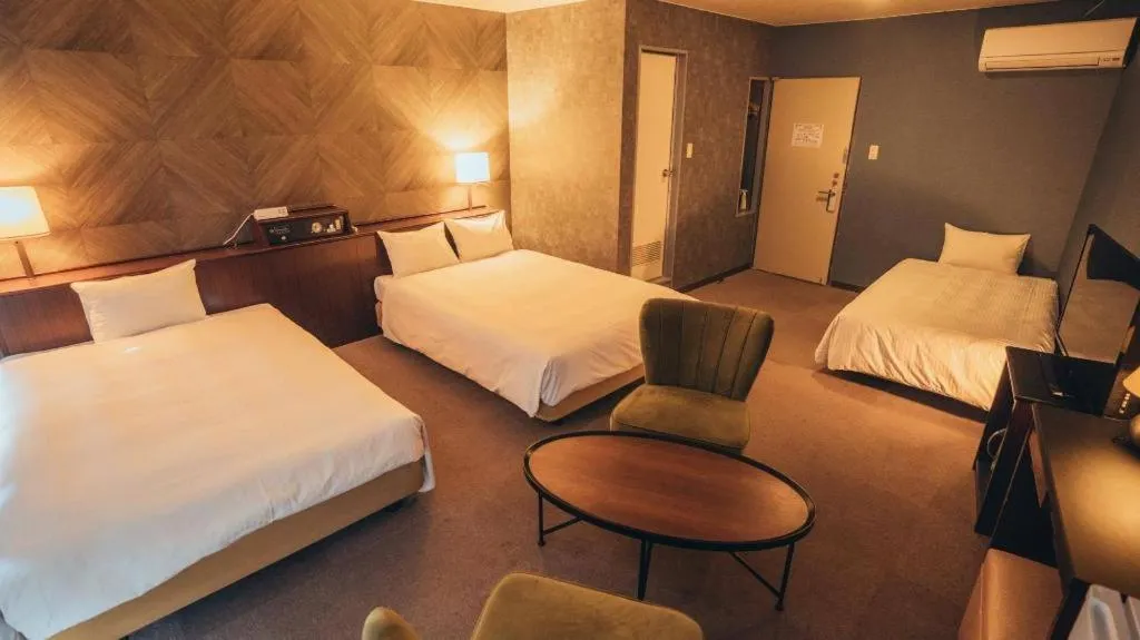 Bed in Hotel AreaOne Miyazaki City