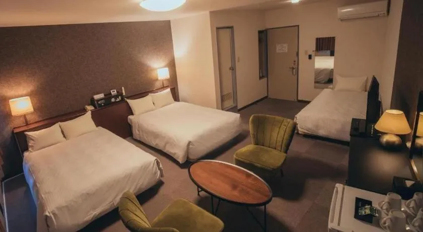 Bed in Hotel AreaOne Miyazaki City