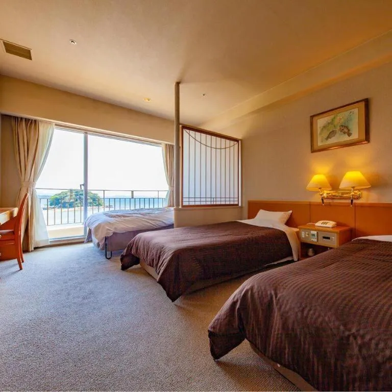 Bed in Hotel Takeshima