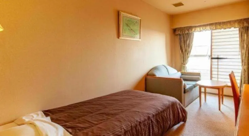 Bed in Hotel Takeshima