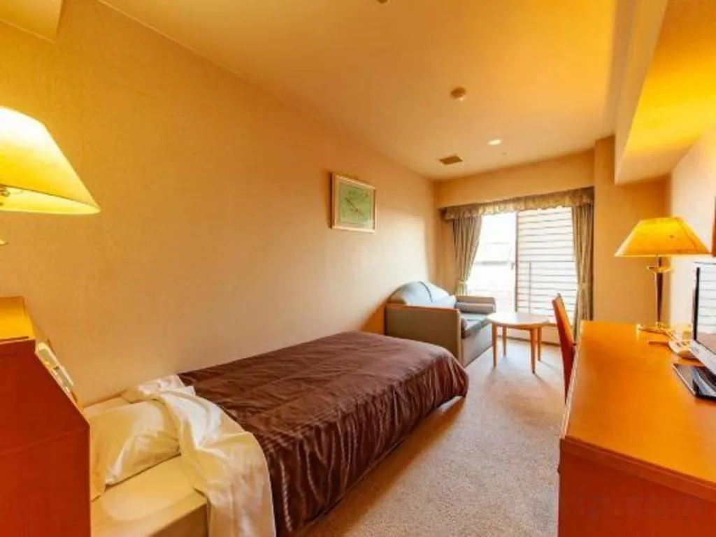 Bed in Hotel Takeshima