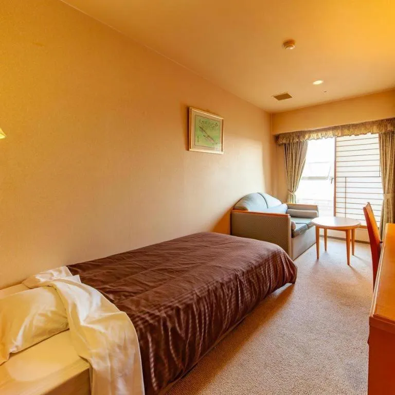 Bed in Hotel Takeshima