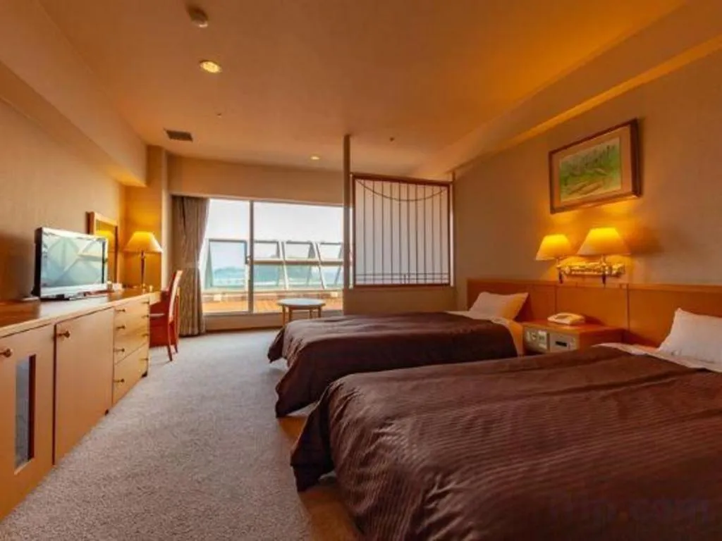 Bed in Hotel Takeshima