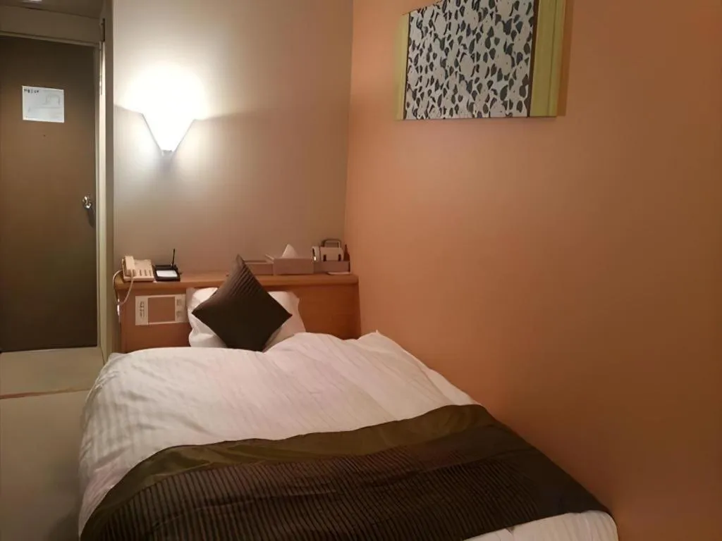 Bed in Hotel Matsumotoro