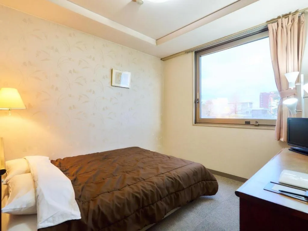 Bed in Hotel Fukui Castle